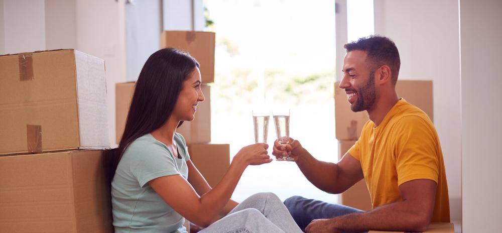 a couple celebrating moving into their new home