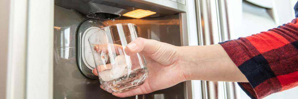 a compartment of ice thats build up in the ice maker